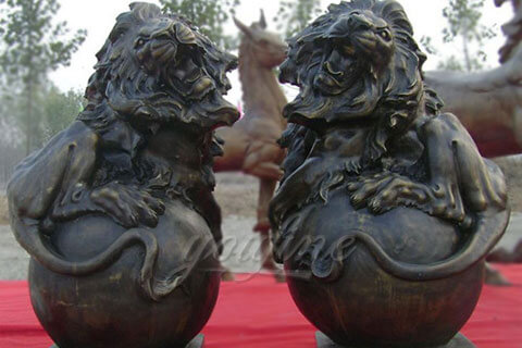 Large outdoor bronze growling lion statues with ball for front gallery of my house