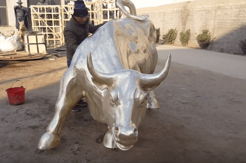 large bronze wall street bull statue outside on discount sale